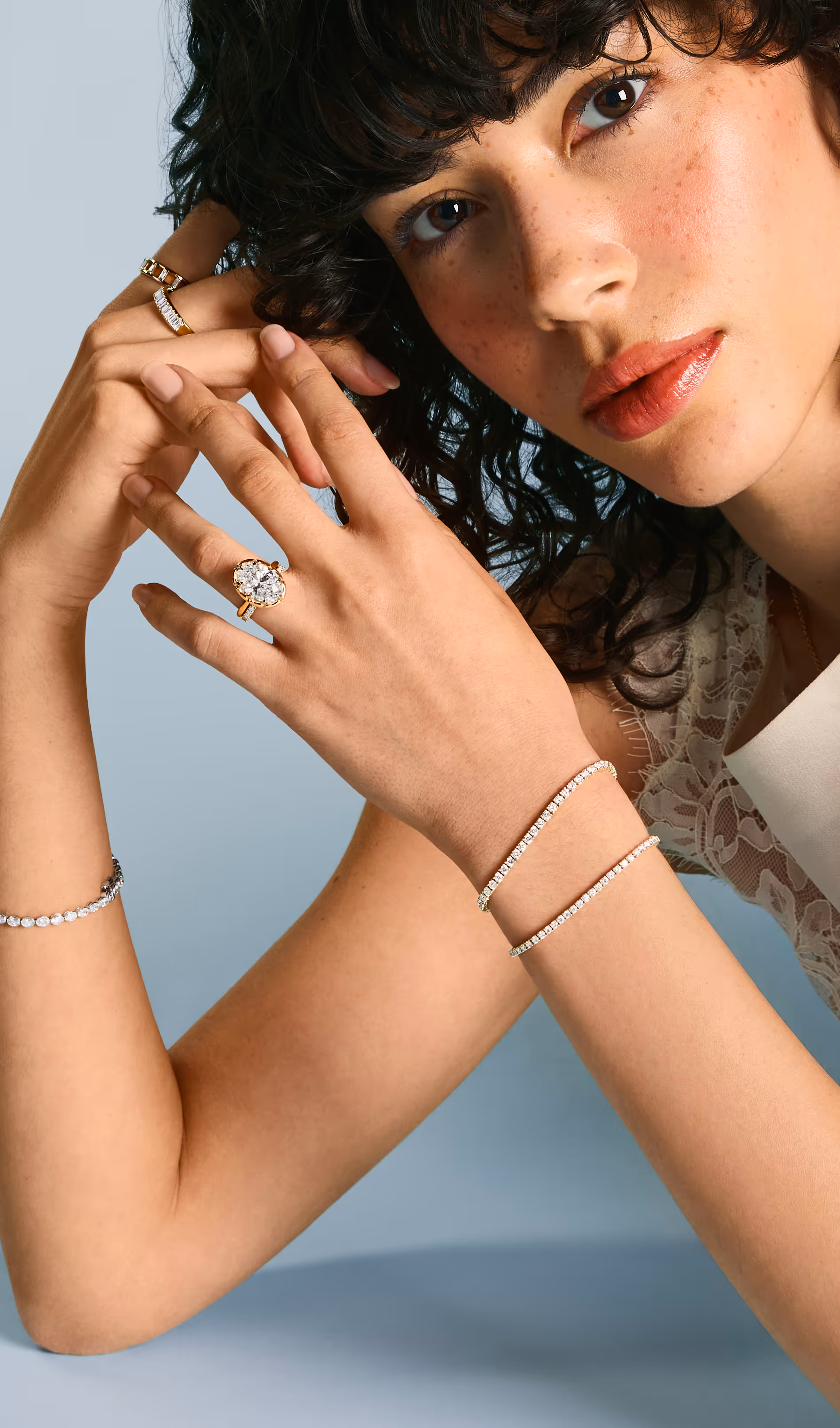 A close-up of an engagement ring with text overlay reading 'Find the Perfect Ring, Make it yours' against a dark background