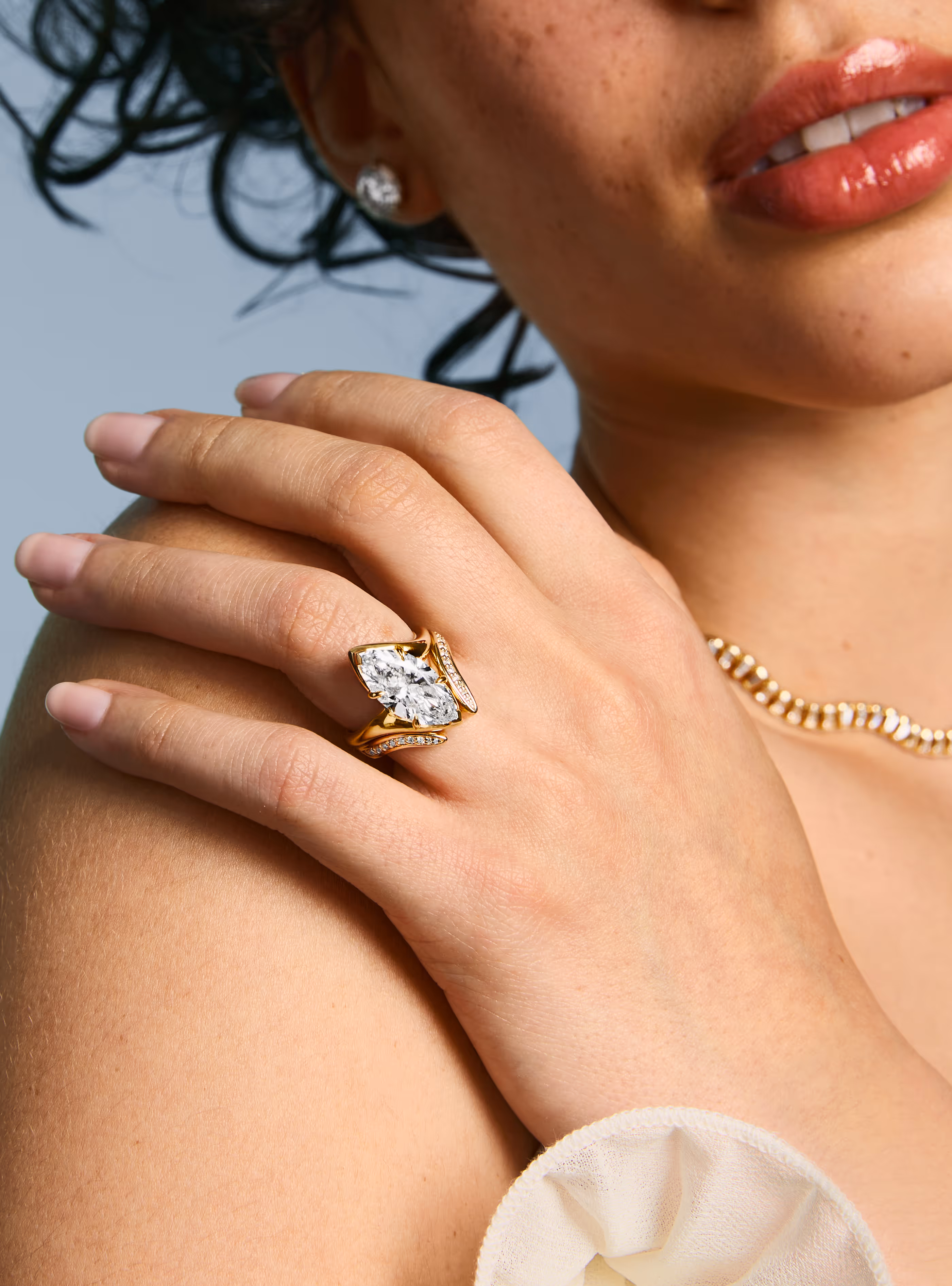 The Ray showcase featuring a lifestyle image of an engagement ring